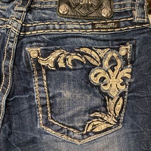 Miss Me boot cut jeans with leather and rhinestone pocket detail, size 27